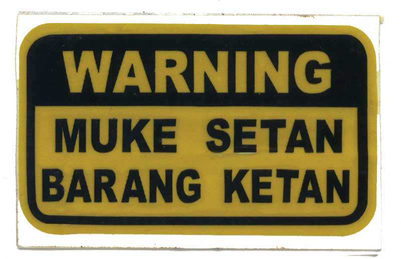 Warning. Satanic face, (sticky) rice package The most common form of the Warning series, depicting a subtle sexual pun 5 rakun